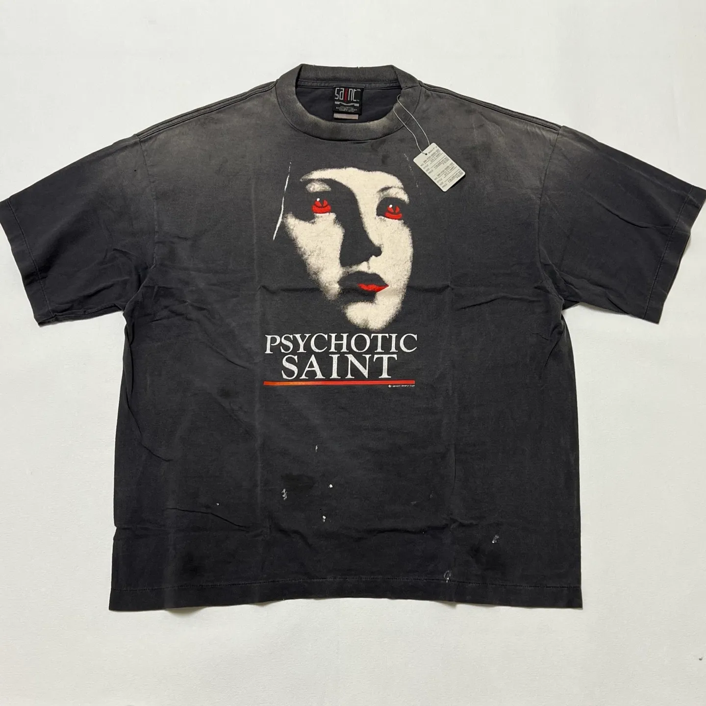 SAINT Mxxxxxx SS TEE/PSYCHOTIC SNT/BLK Gothic heavy metal rock style retro short-sleeved Mysterious woman's face printed distressed TEE Washed black S-XL Same as the original version Cylindrical side seam OE yarn fabric Garment dyeing Faded by heavy washing Bust plaster faded Correct version Matching of original accessories